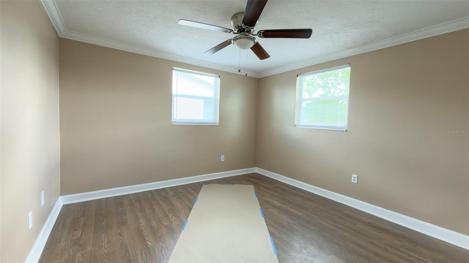 Secondary bedroom offering flexibility for guests, office, or personal space.