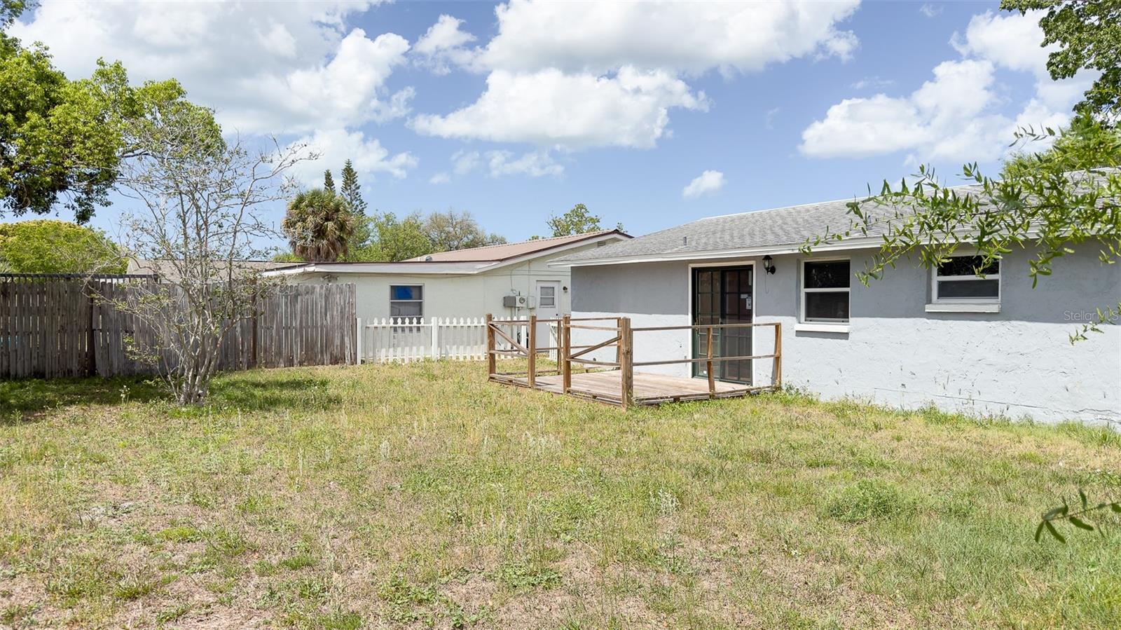 Spacious fenced yard—perfect for pets, play, or creating your dream outdoor retreat.