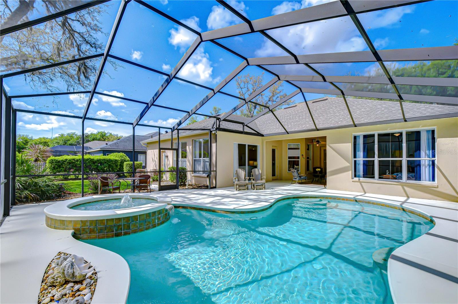 Oversized screened lanai with privacy screening.