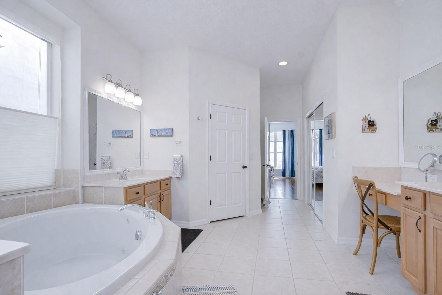 Soaking tub and separate walk-in shower.
