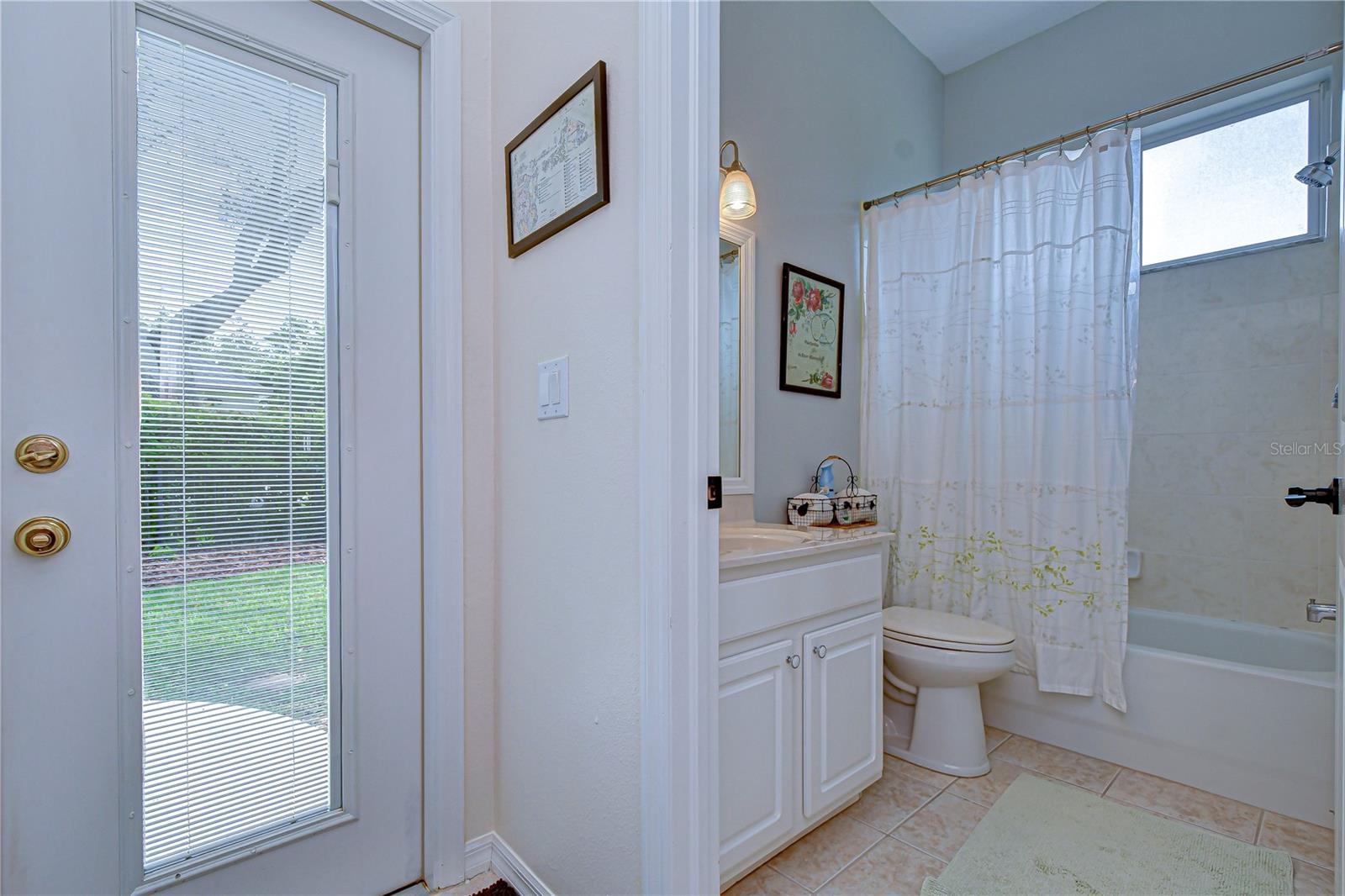 Full bath conveniently located for guests.