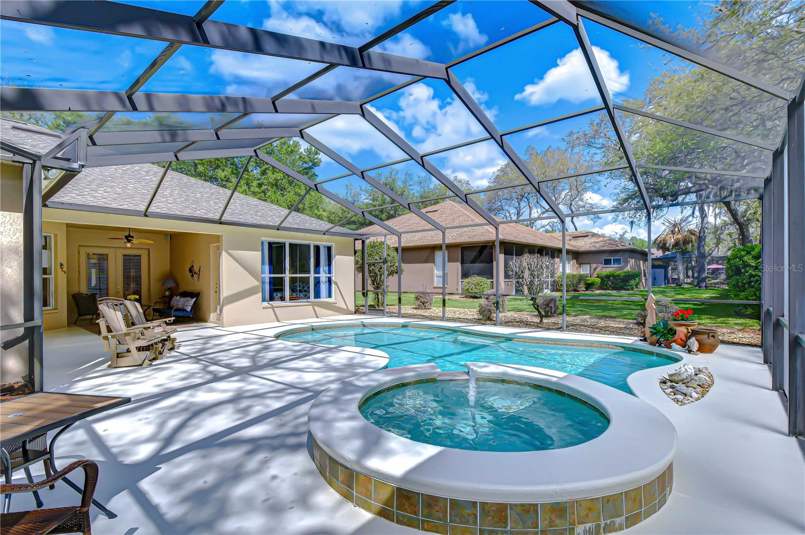 Caged pool with spa.