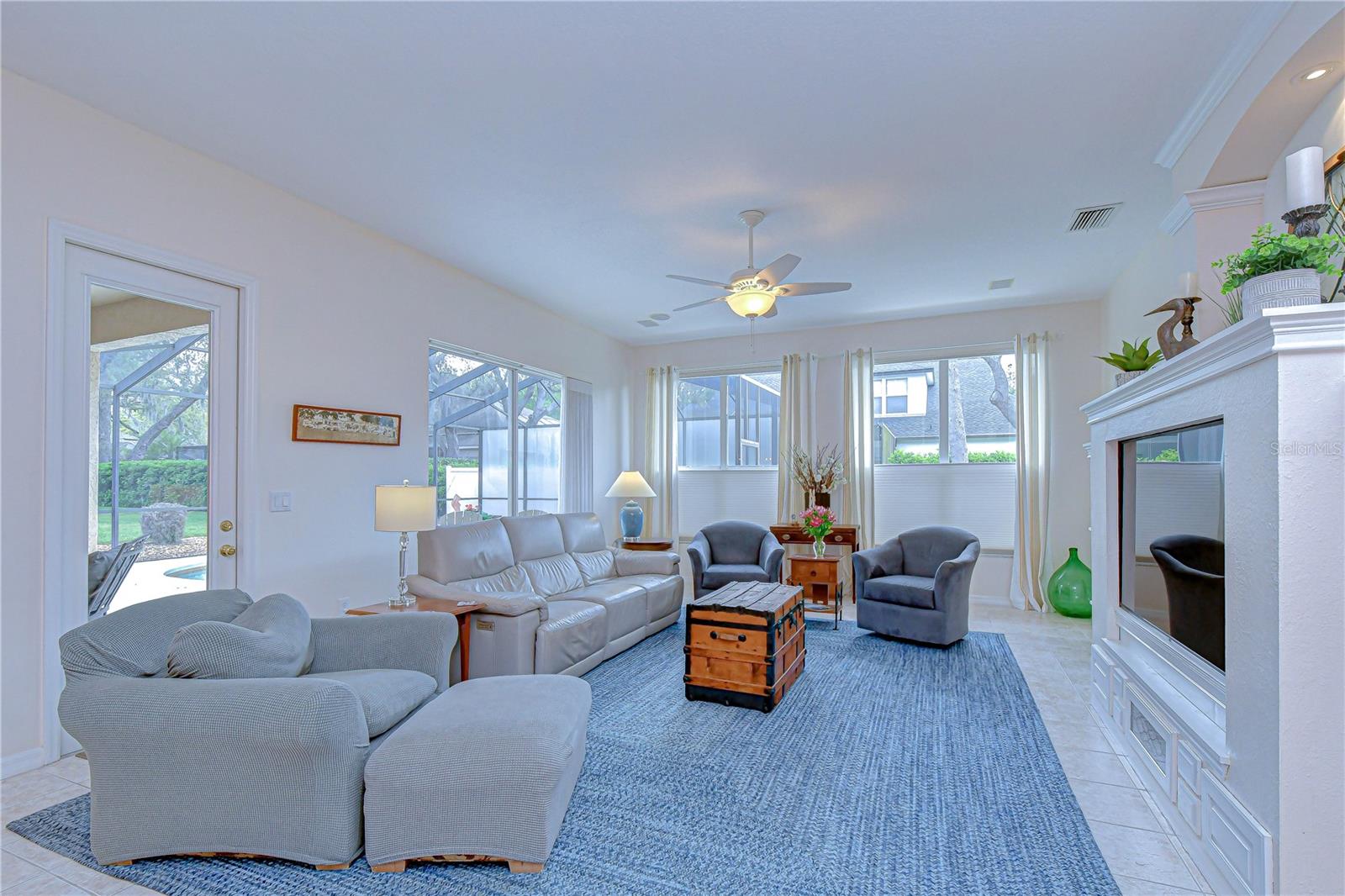Light-filled formal living space with neutral tones.