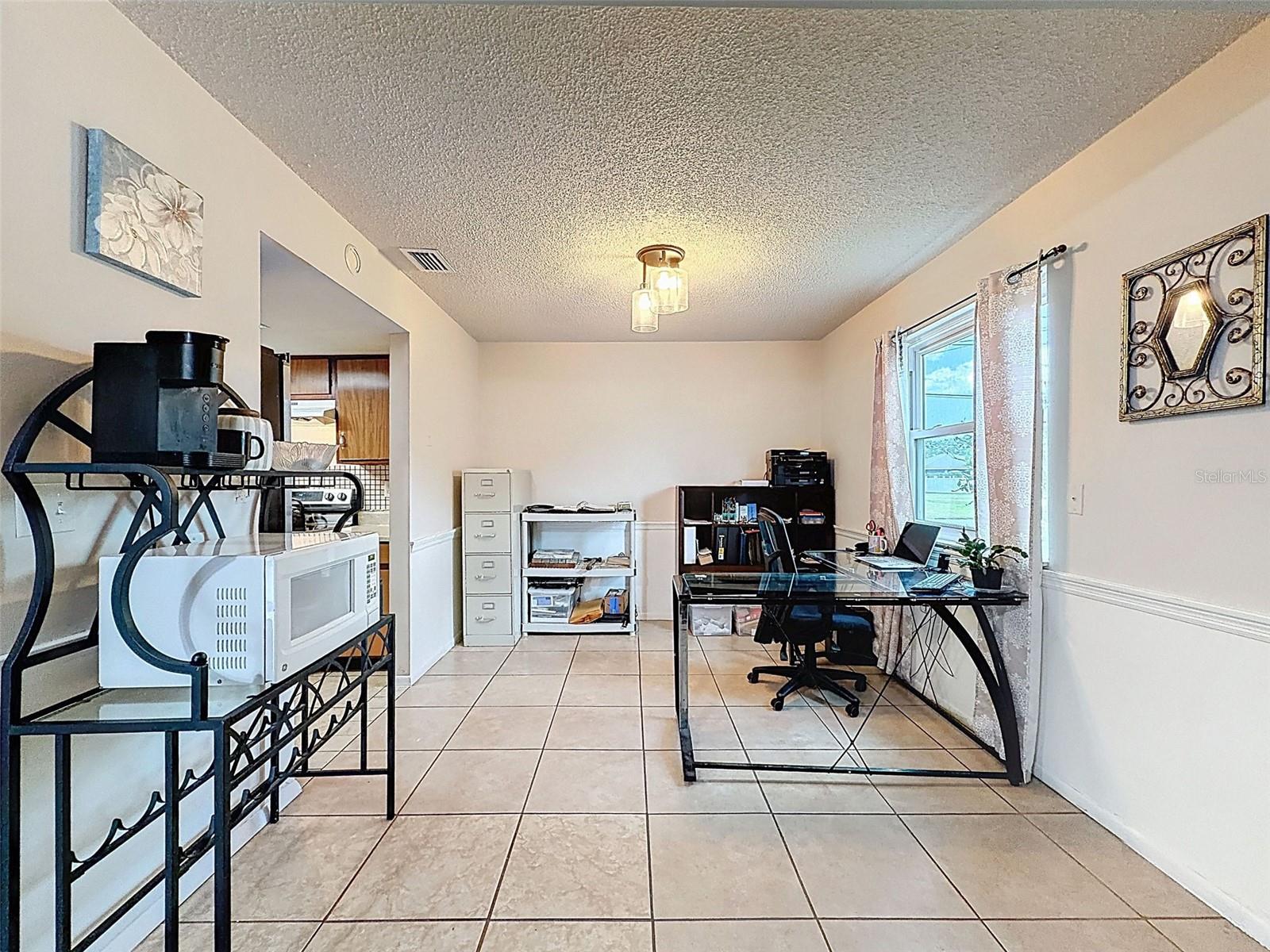 Dining room used as an office, but there are THREE bedrooms total.