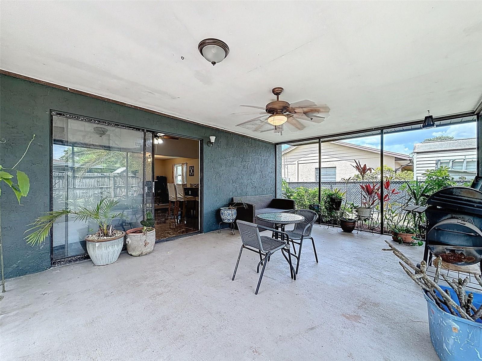 Large backyard patio with fan and fully screened. 19’9” x 14”!