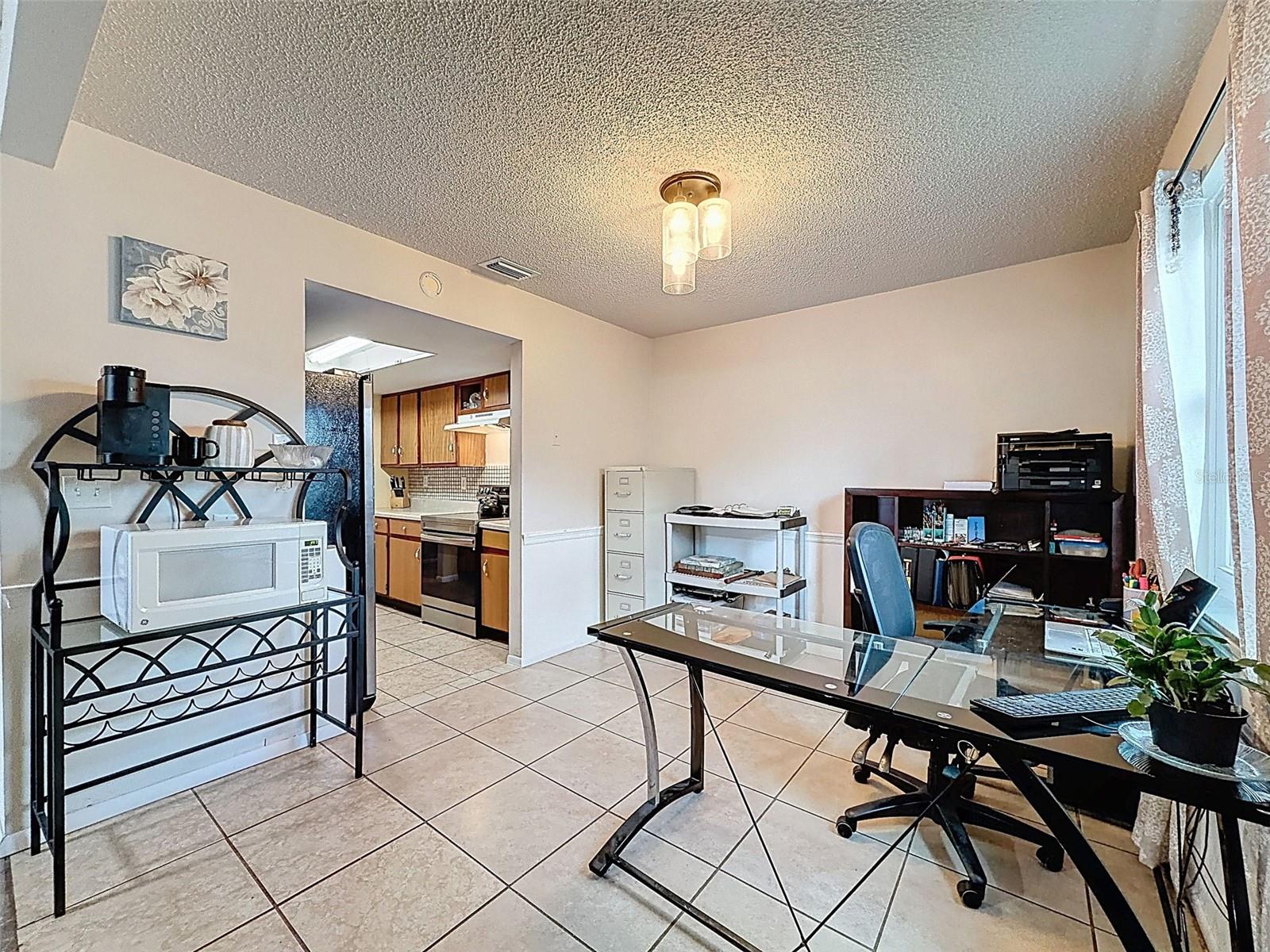 Dining room used as an office, but there are THREE bedrooms total.