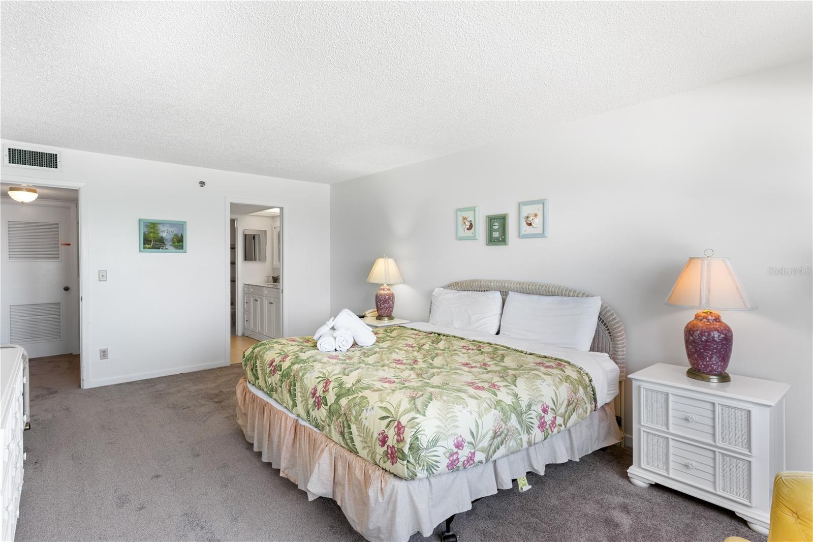 Primary Bedroom with waterview and sliders to the balcony