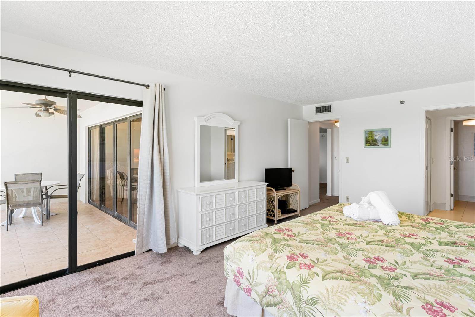 Primary Bedroom with waterview and sliders to the balcony