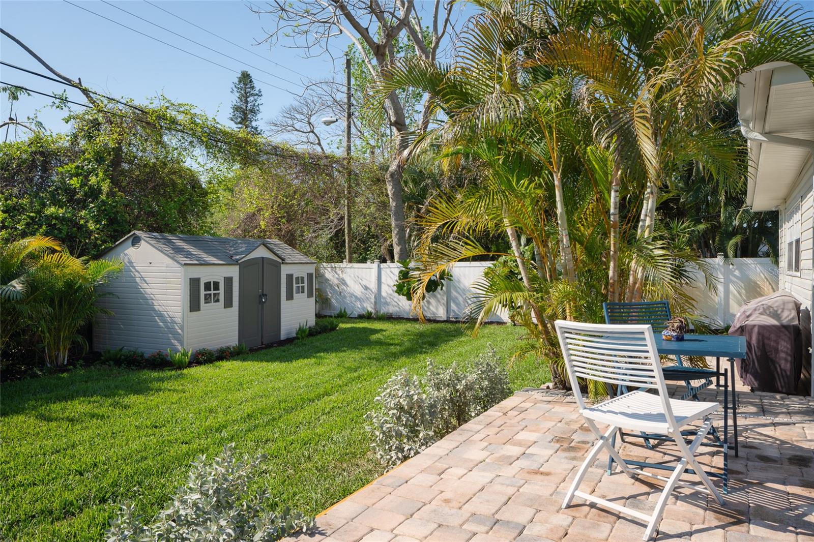 Fresh sod + landscaping + large shed