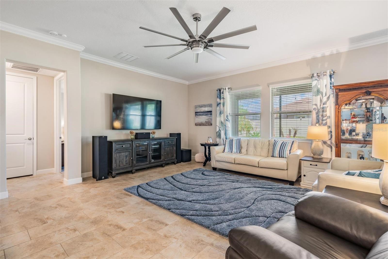 Large family room with upgraded fan and lighting