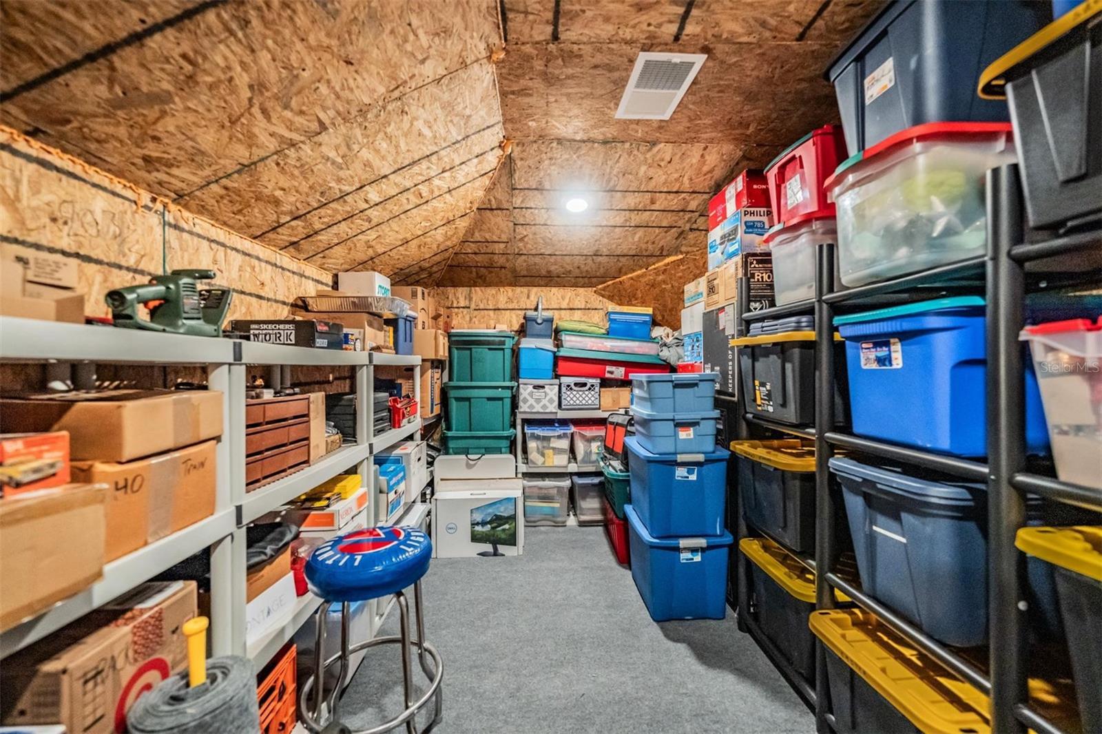 Storage over garage w/staircase makes it easy to store items!