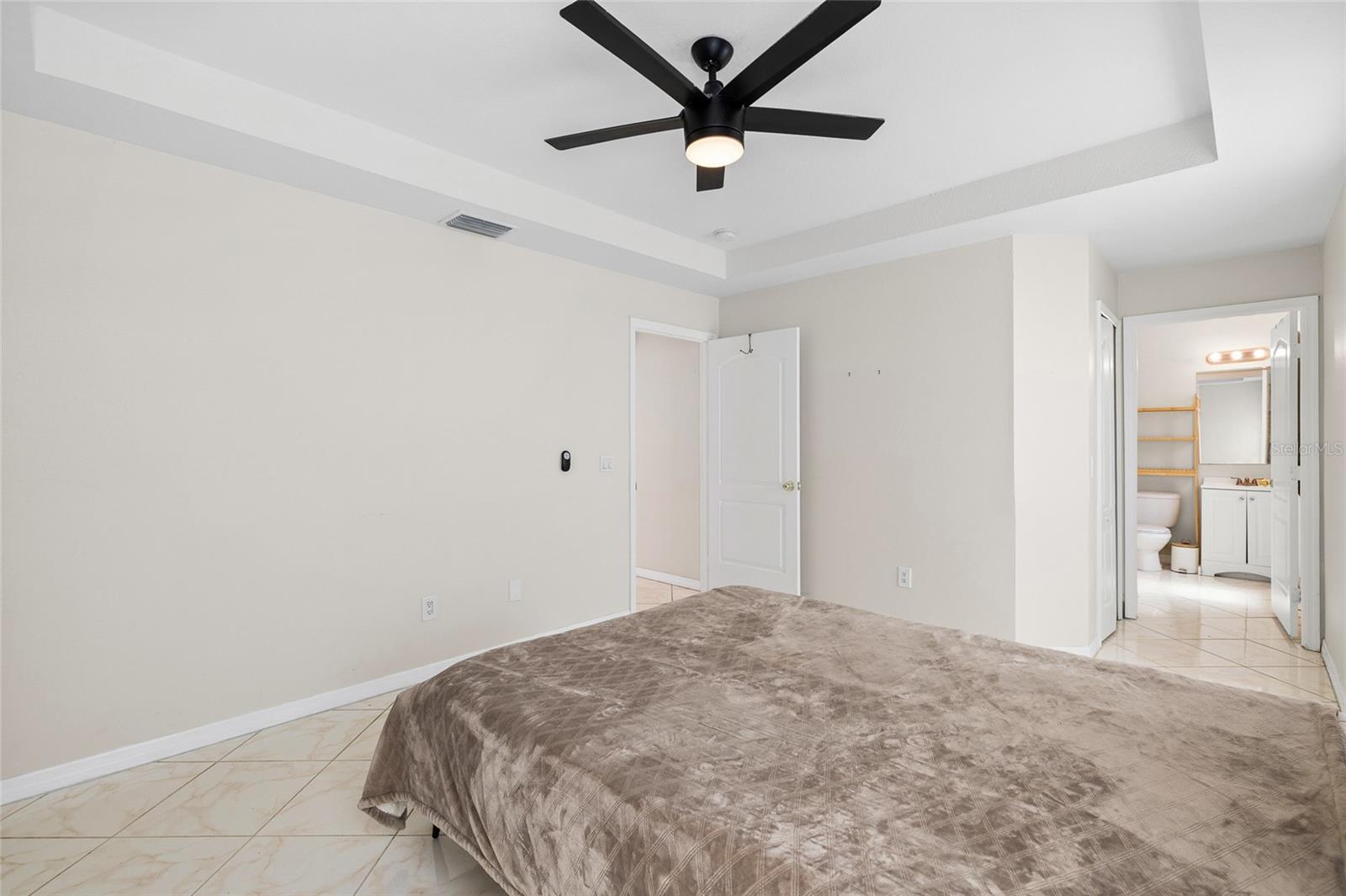 Primary bedroom with entry to walk in closet and Primary Bath