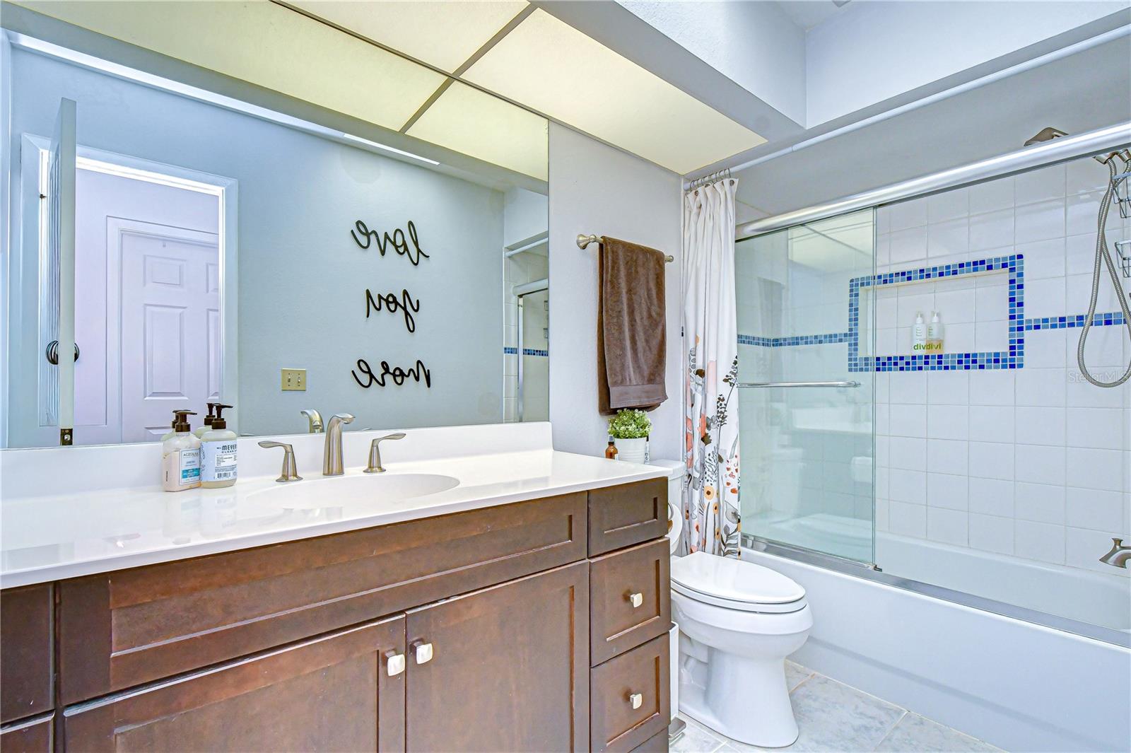 Skylight providing natural light to the bathroom.