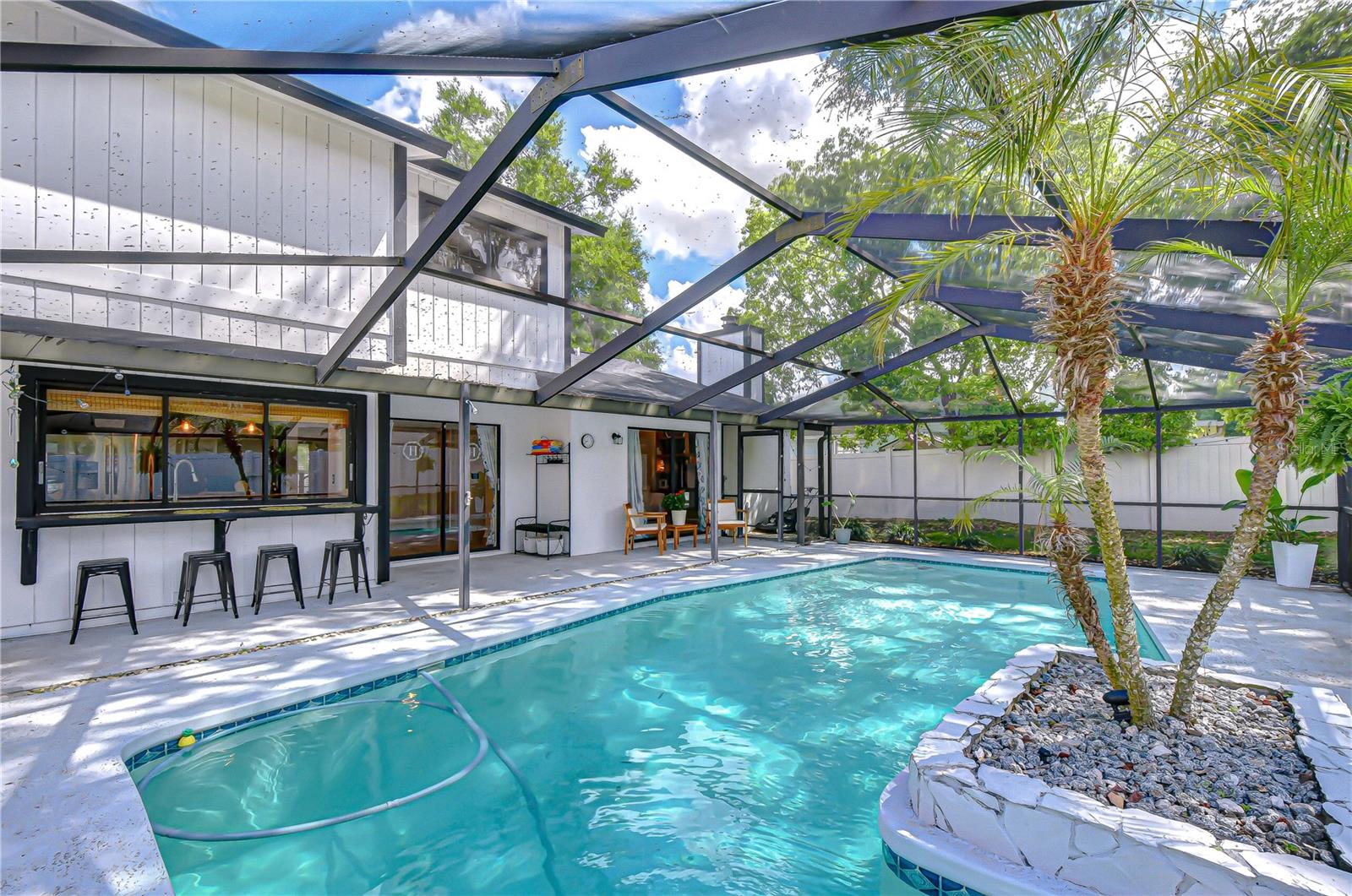 Oversized screened-in pool enclosure.