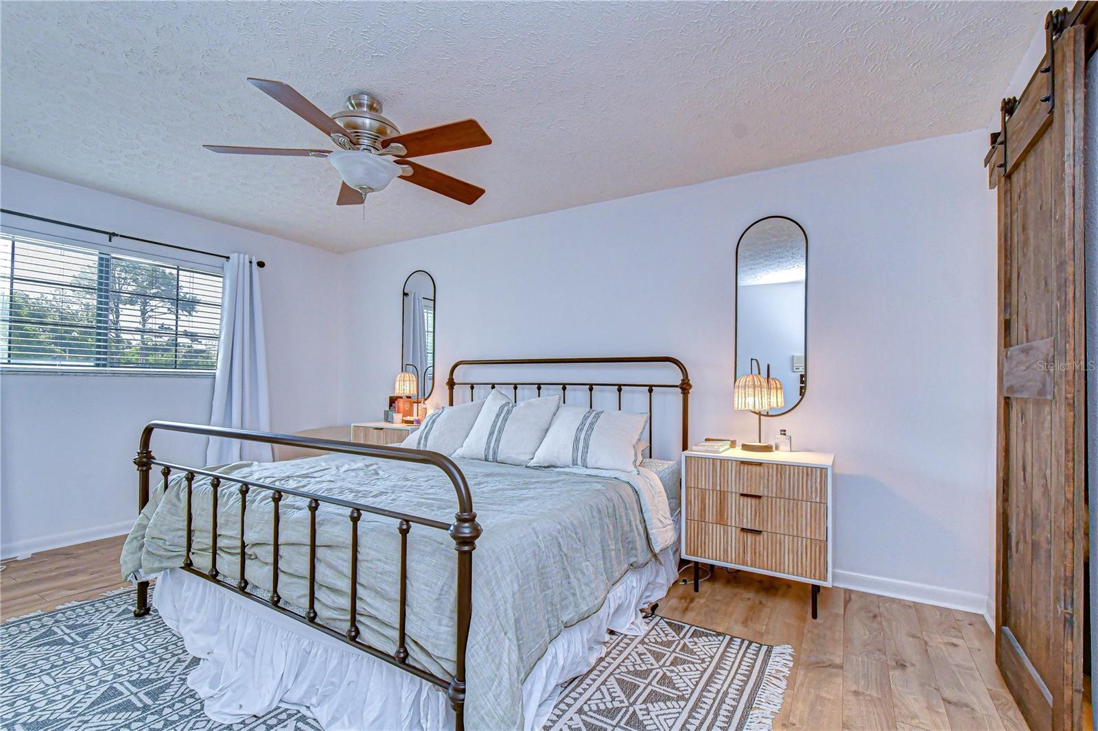 Spacious upstairs retreat with natural light.