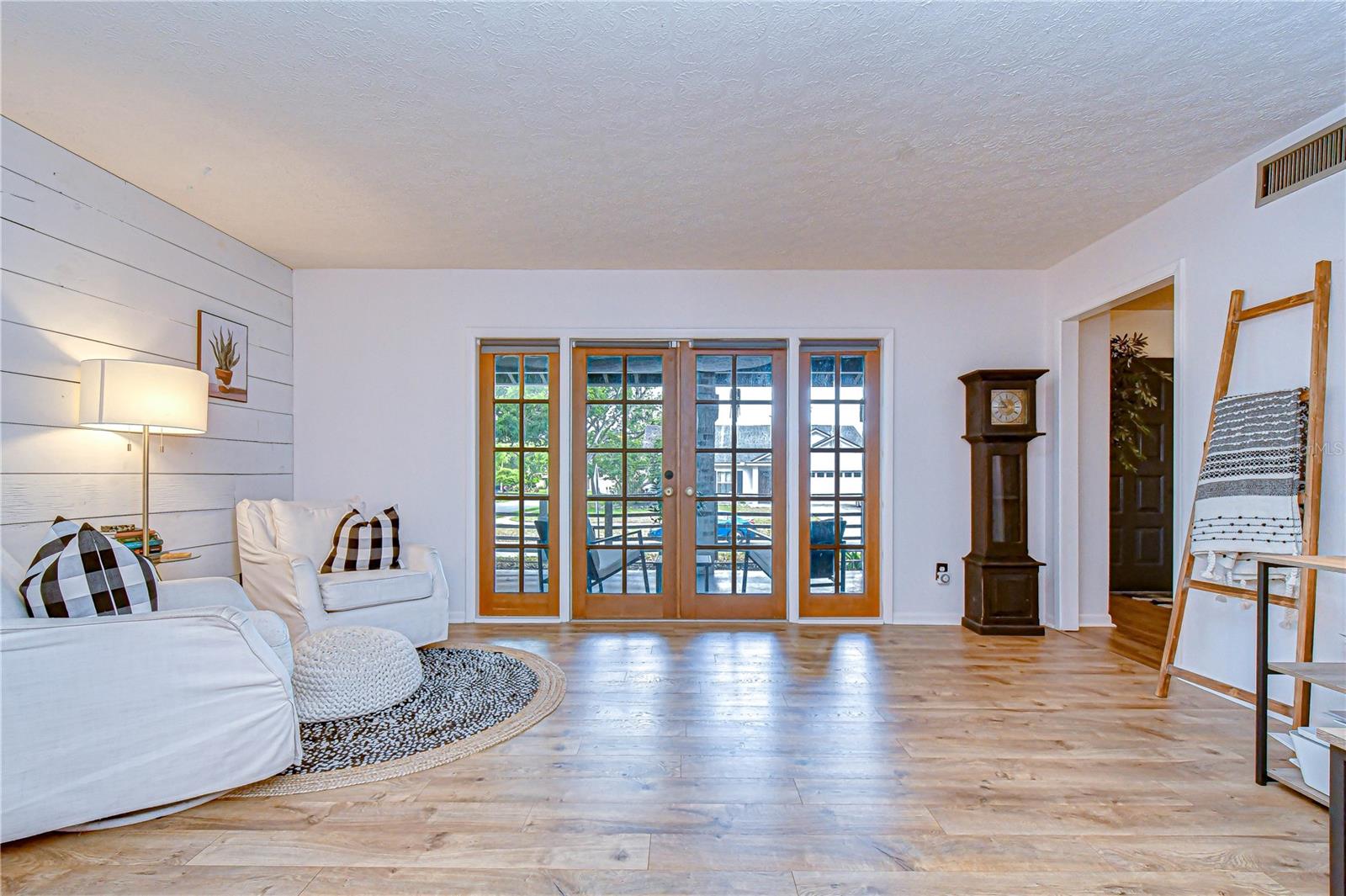 French doors opening to the outdoor living area.
