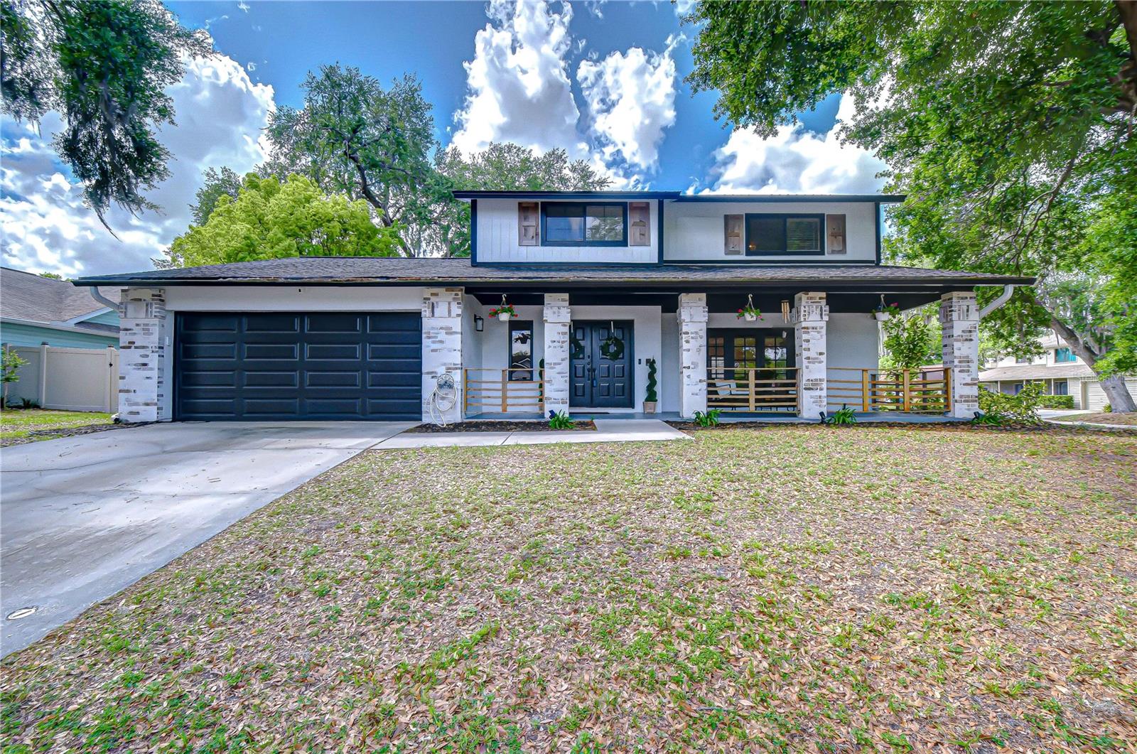 Two-car garage with ample driveway space.