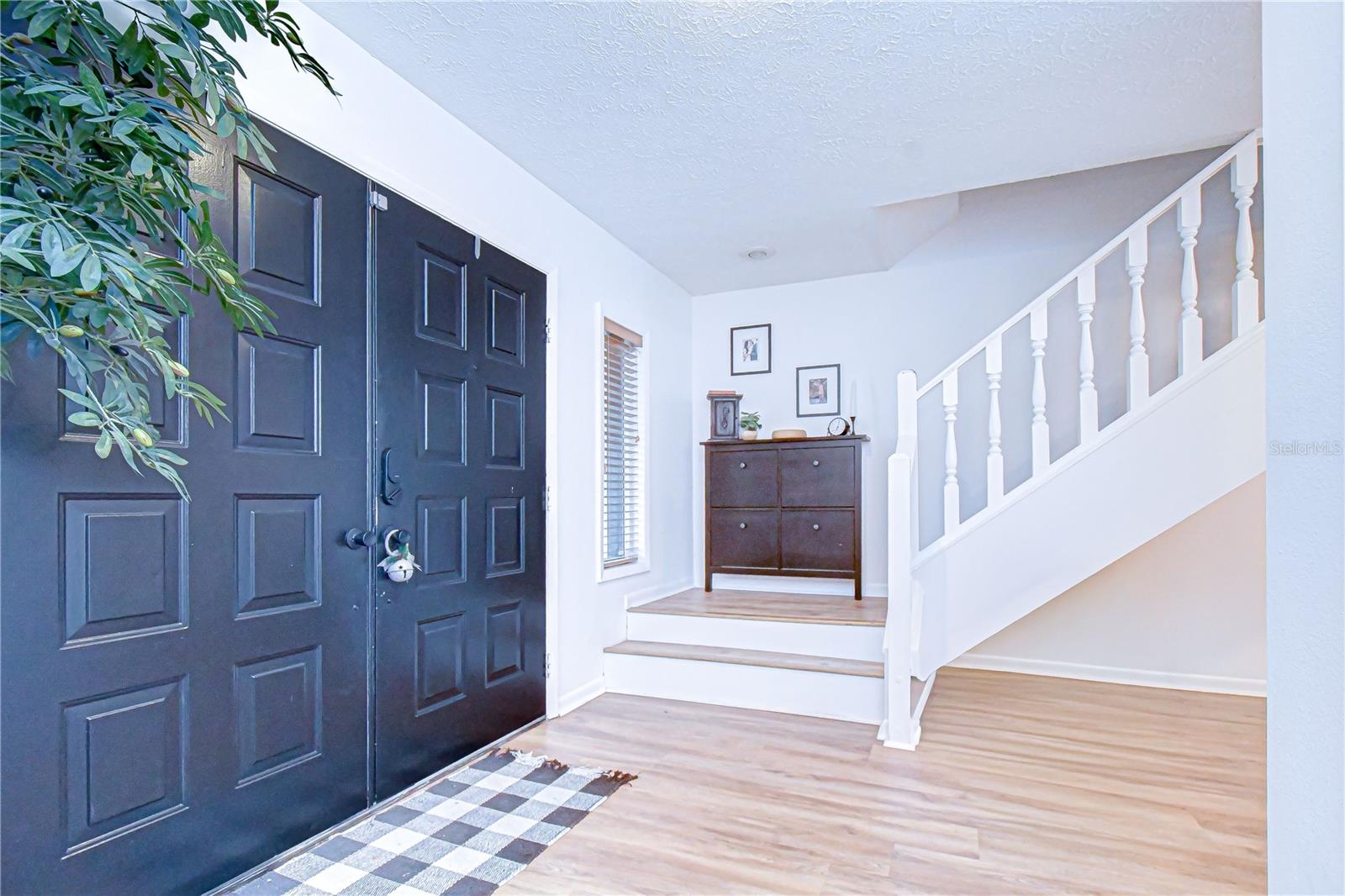 Enter the home and you are greeted with a grand staircase to the second floor!