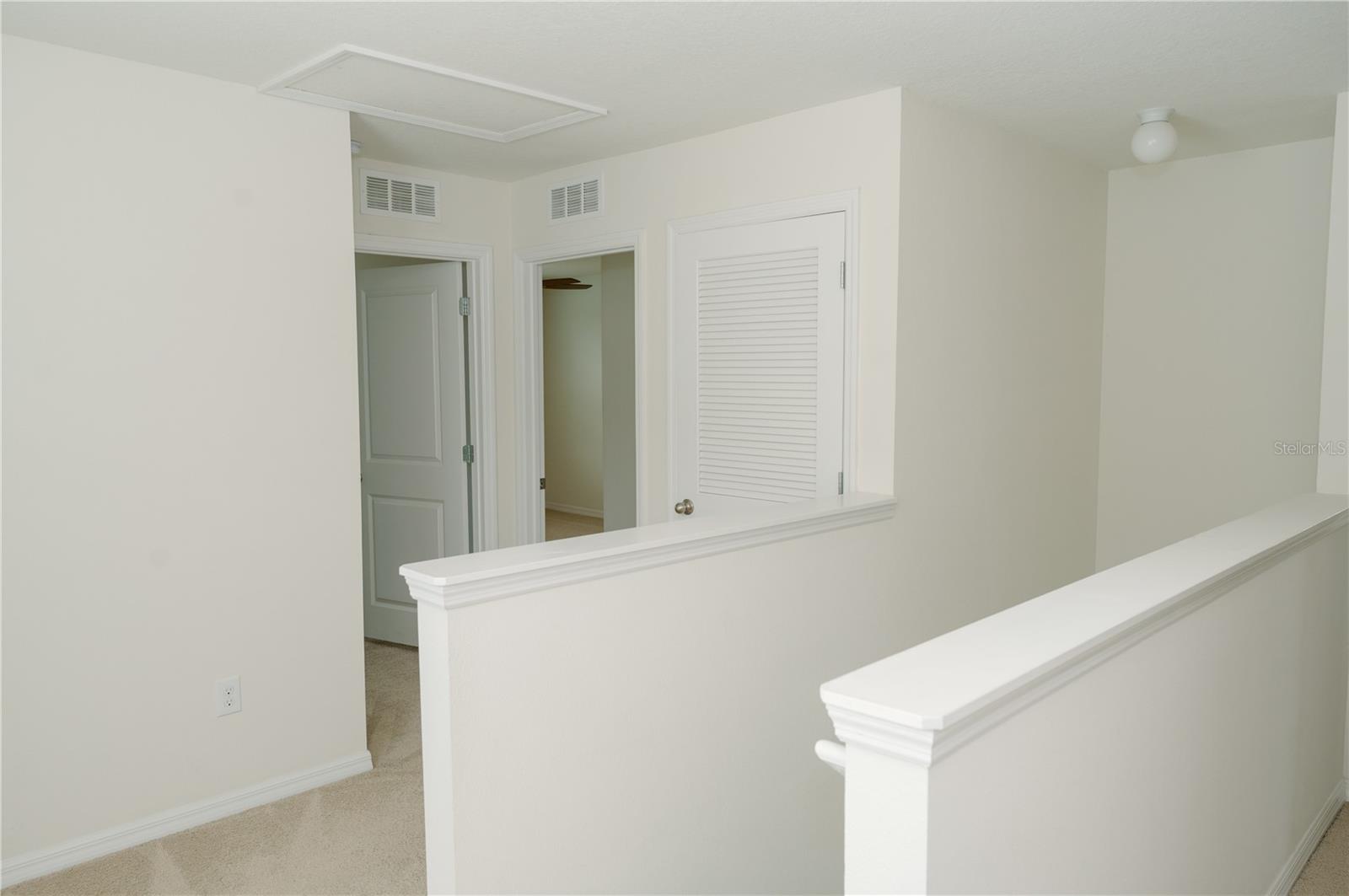 Top of stairway, 2nd floor. Looking towards air handler closet, bedrooms 1&2