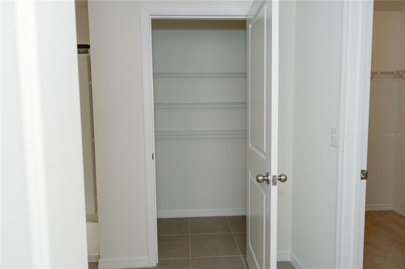 Primary bathroom linen closet