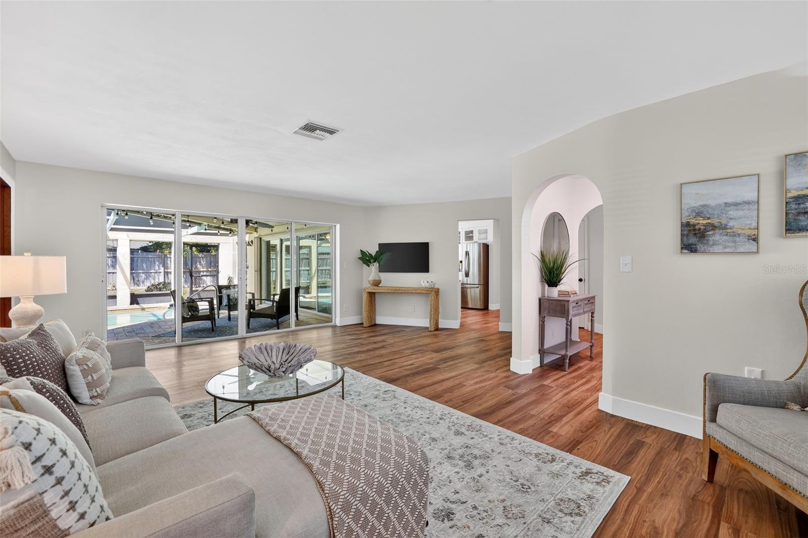 Living room with views and walkout to the pool