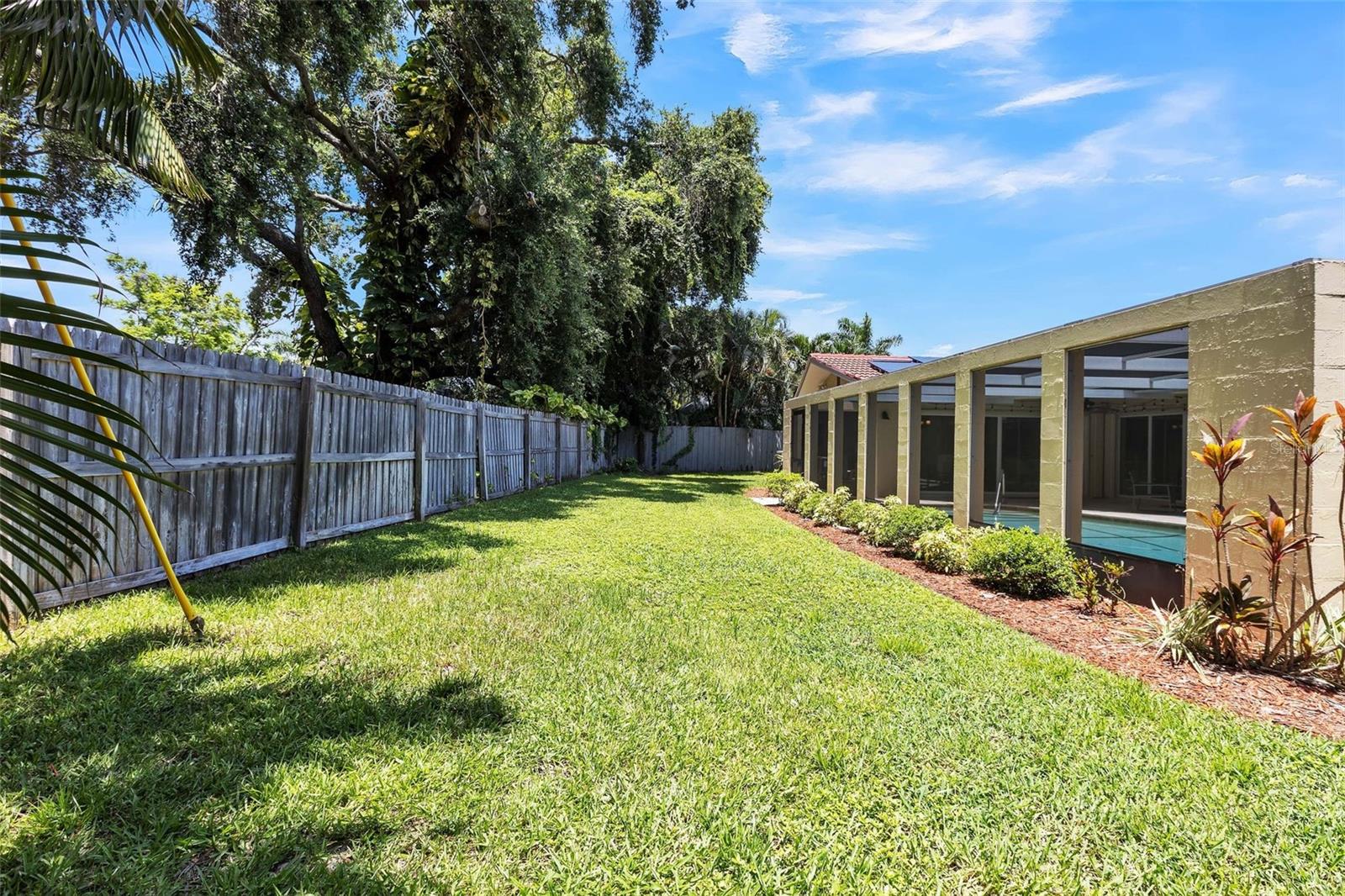 Large green space outside of the lanai