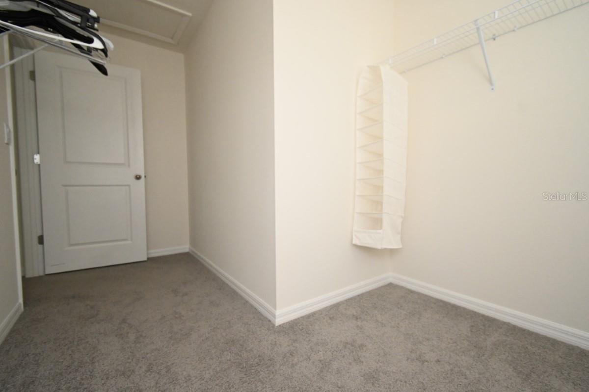 PRIMARY BD RM WALKIN CLOSET