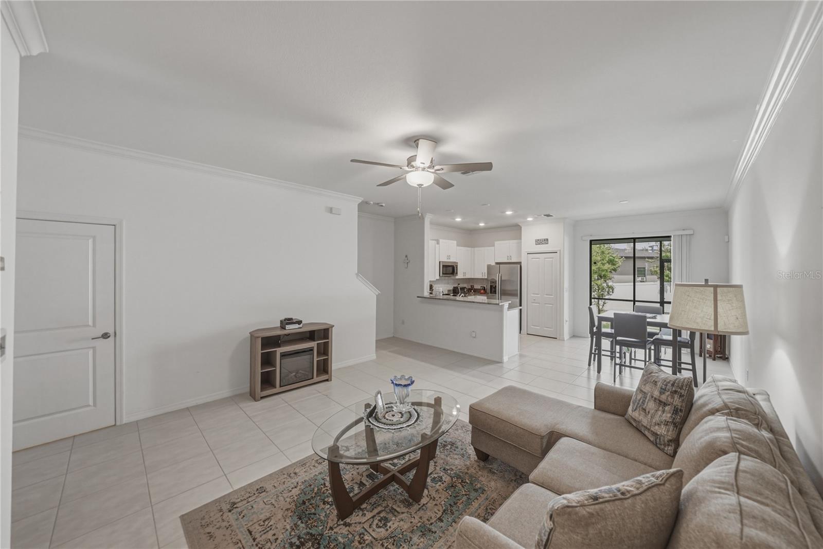 Open Living, Dining and Kitchen with Crown Molding