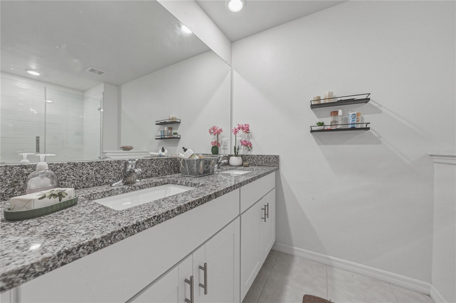 Primary Suite Bath with Dual Undermount Sinks, Granite Countertops, Full Overlay Shaker Cabinets and Hardware