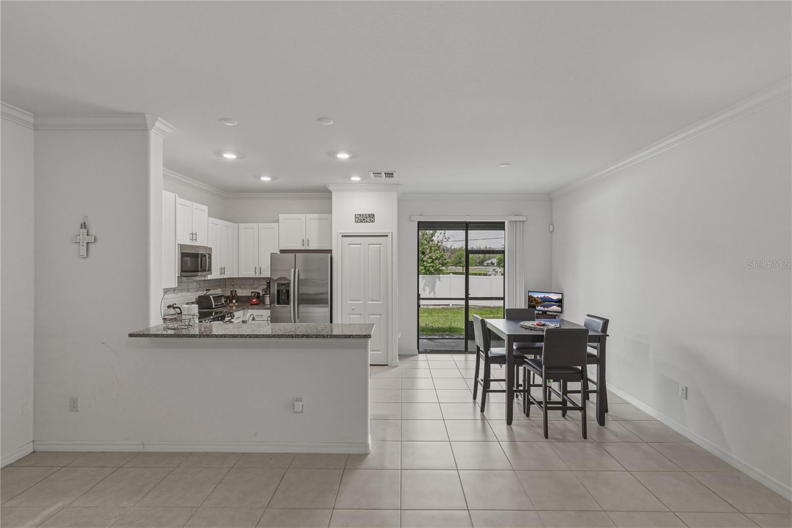 Kitchen and Dining Area with Bar Top Seating