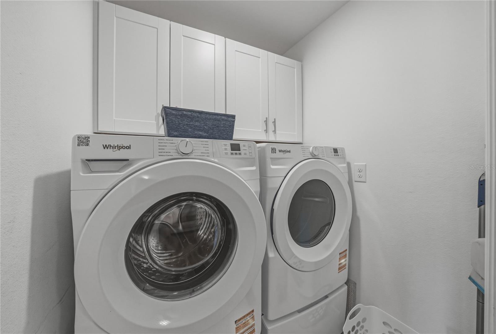 Dedicated Inside and Upstairs Laundry Room with Full Overlay Shaker Cabinetry with Satin Nickel Hardware