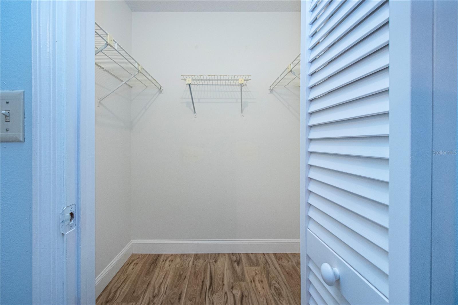 Walk-in closet in primary bedroom