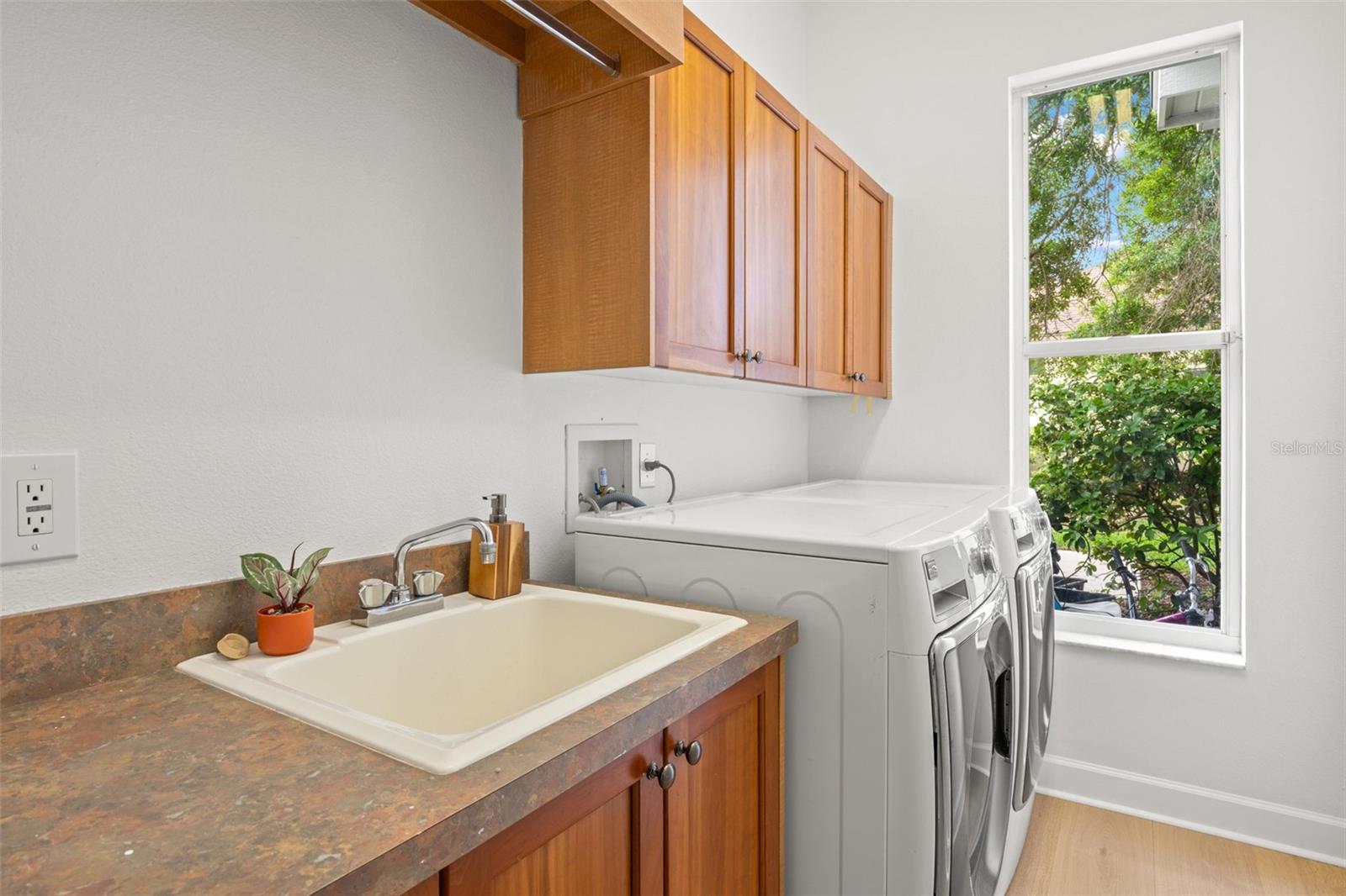 Laundry room, located off the kitchen, with extra storage