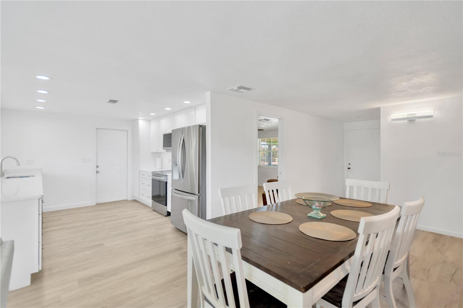 Light, bright sparkling dining area and beautifully appointed kitchen with clean, sleek lines will sure to delight.