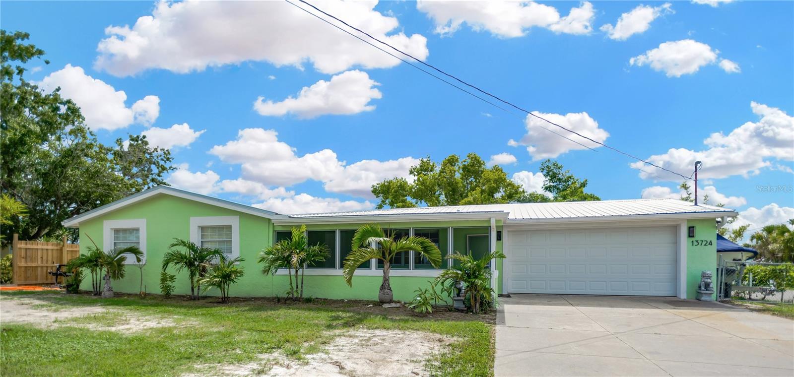 13724 COX AVENUE ~ a perfect place to call home ~ featuring .23 acres of land.  Boat and trailer parking is available on both sides of the house ~~ fully fenced yard.