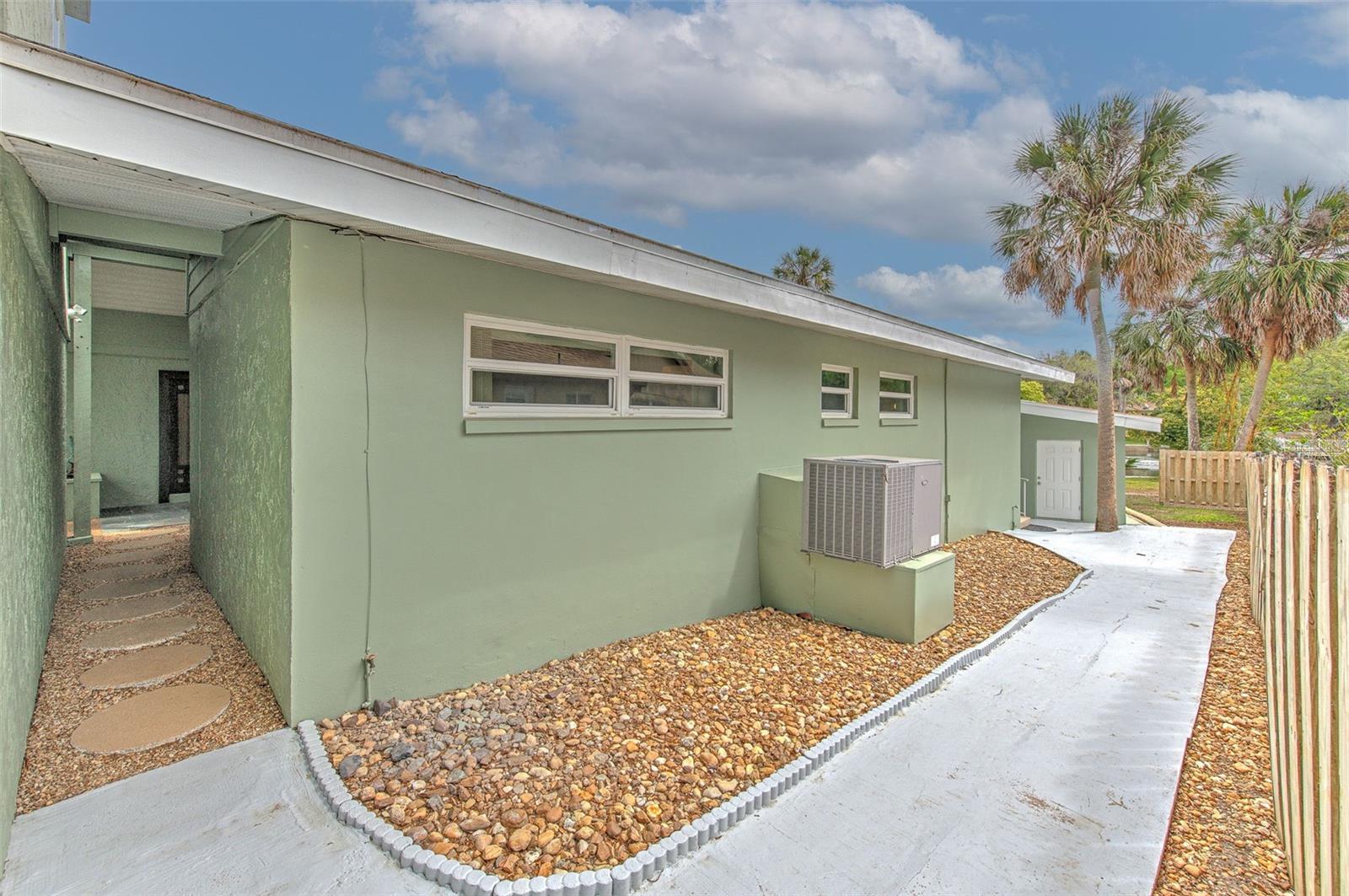 Side of home that leads from front door to backyard