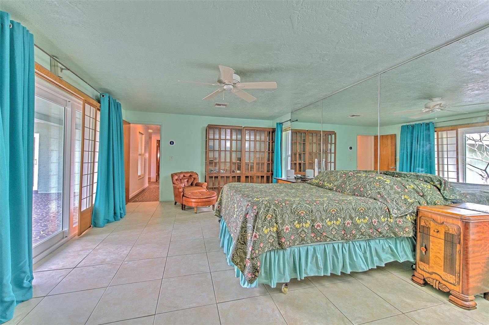 Master Bedroom 1 overlooking water and rock garden