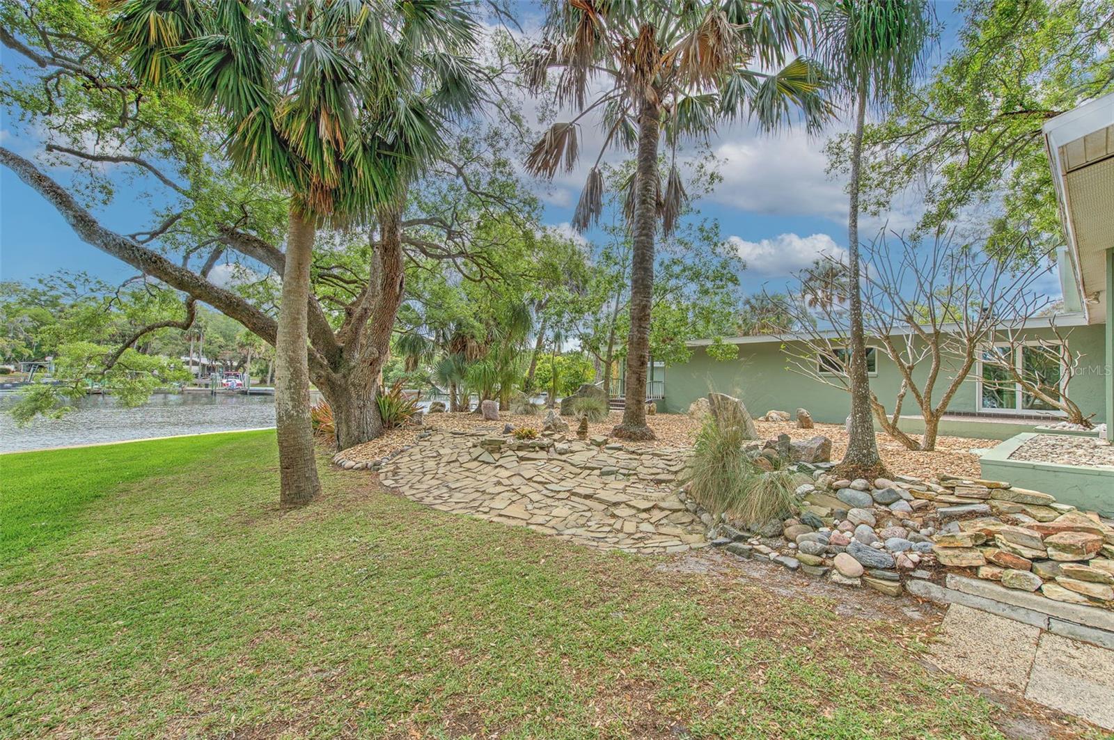 Backyard waterfront views & rock garden