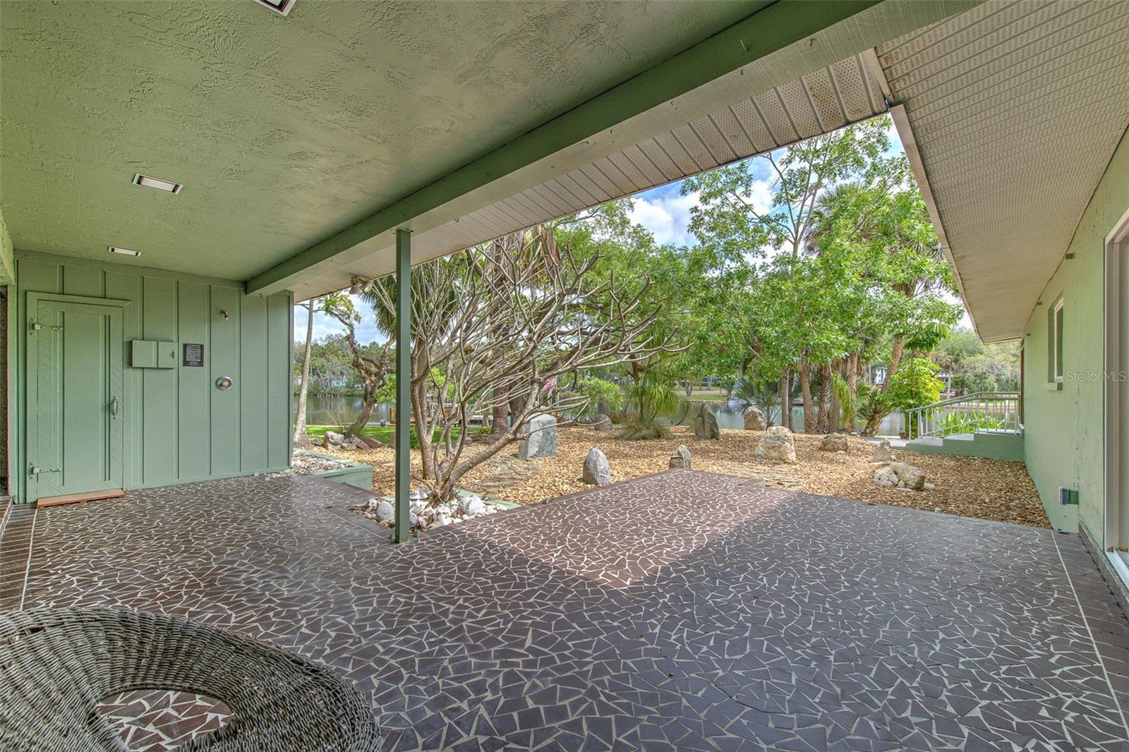 View of Sauna , rock garden & water from outside Master Bedroo