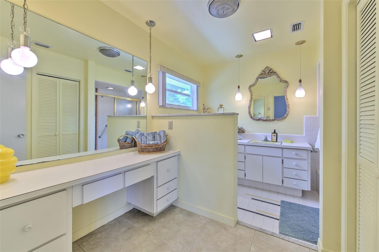Master enSuite bathroom 2 with separate sink vanity, and separate makeup vanity area with full length medicine cabinet built in wall