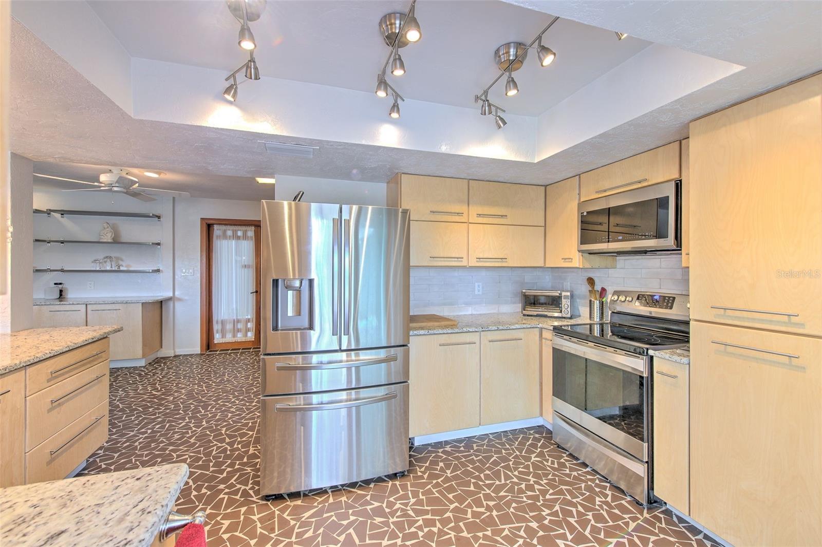 Huge kitchen, custom cabinetry, beautiful granite countertops , stainless steel appliances