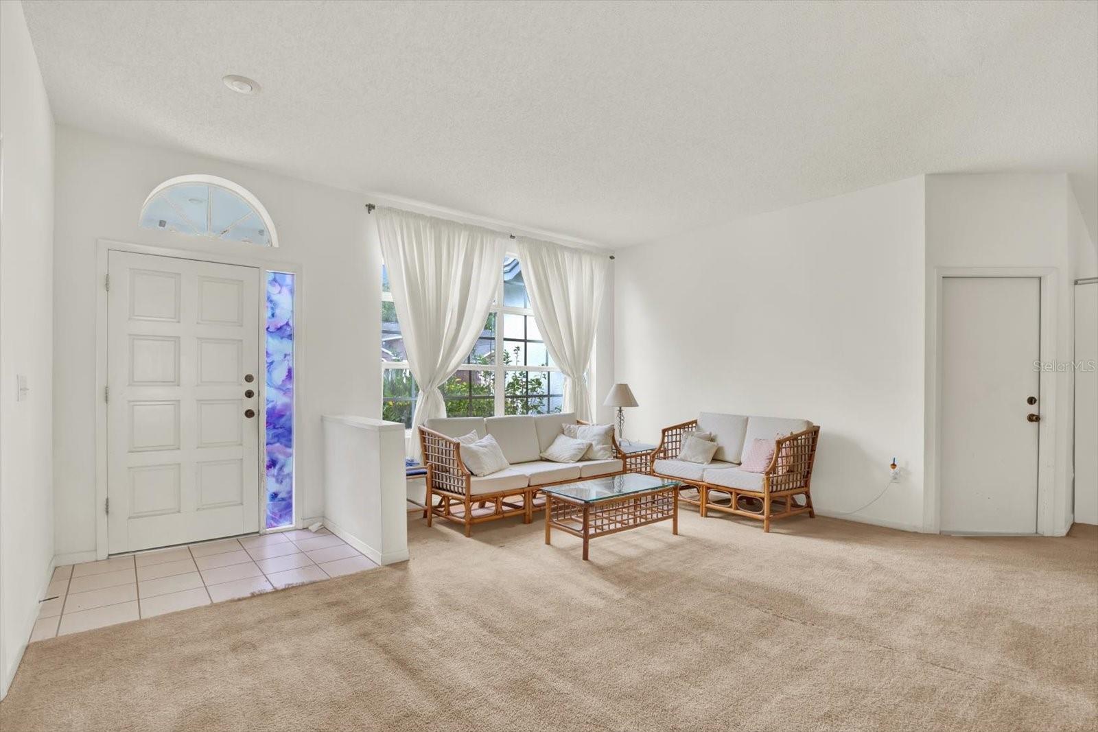 Welcoming formal living room off entry