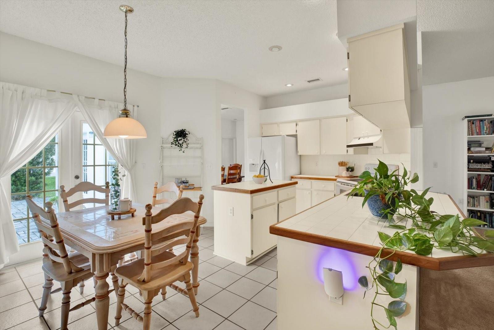 Spacious eat-in-kitchen with patio access