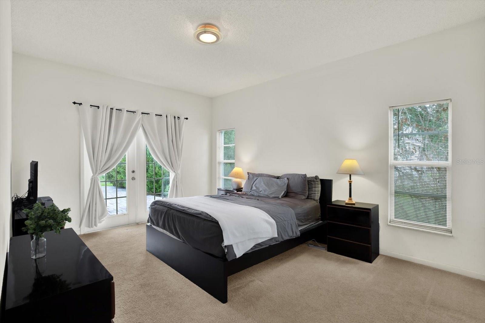 Primary bedroom with patio access