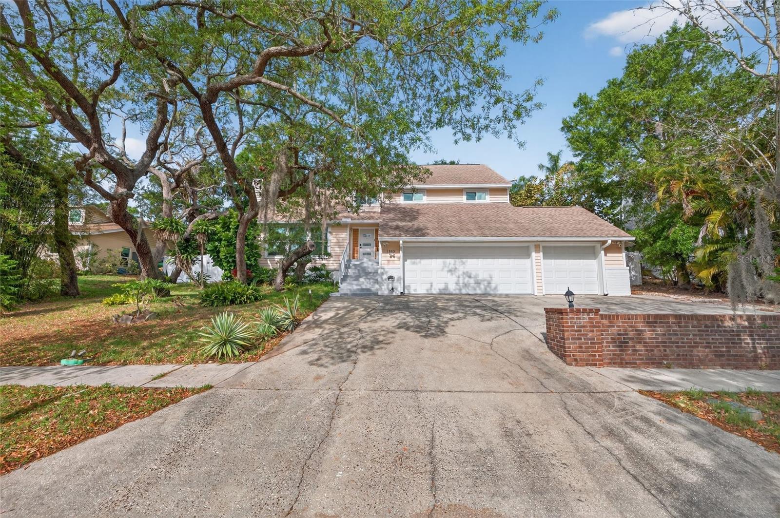 The home sits on a hill and features an extra large driveway with plenty of space to park cars, trucks or other recreational toys.