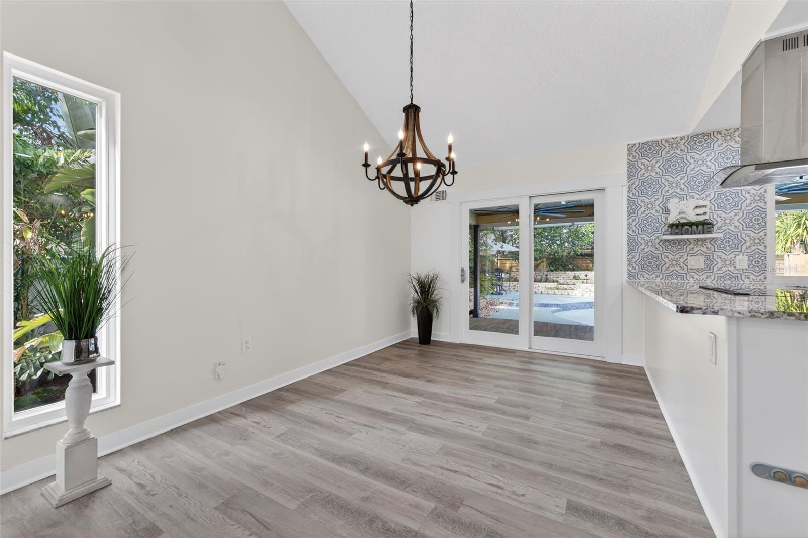 Dining area with access to the back yard/pool.