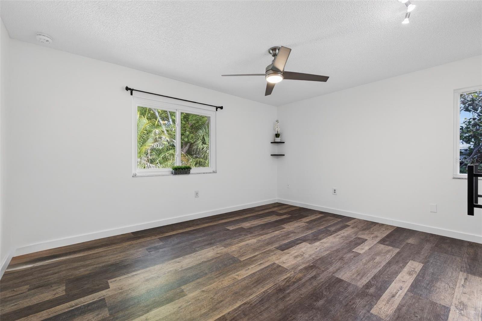 Bedroom #2 is featuring luxury vinyl flooring, built-in closet and a ceiling fan. All windows are hurricane proof with lifetime warranty.