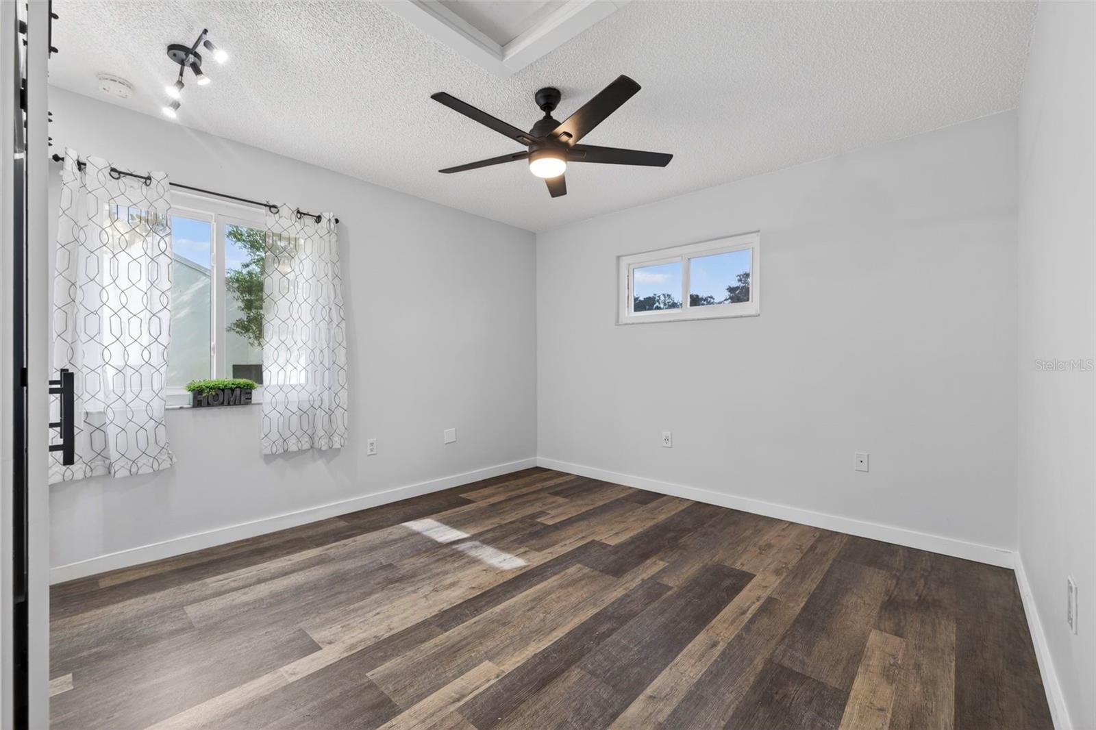 Bedroom #3 - Featuring ceiling fan, built in closet, and luxury vinyl flooring.