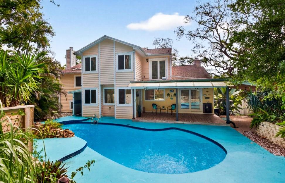 The pool features a newer pump and solar heating on the roof.