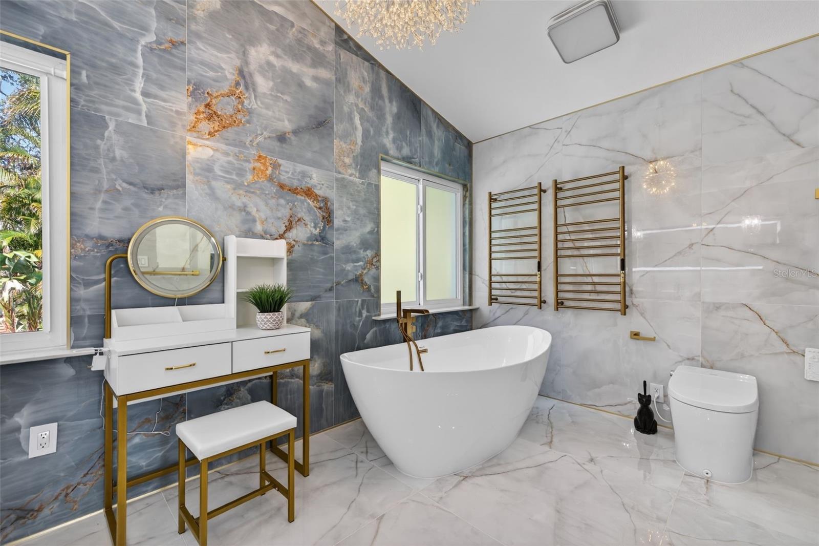 Master Bathroom - fully renovated bathroom with soaking tub, chandelier, heated seat toilet/bidet combo (touchless flushing), and heated towel rack.